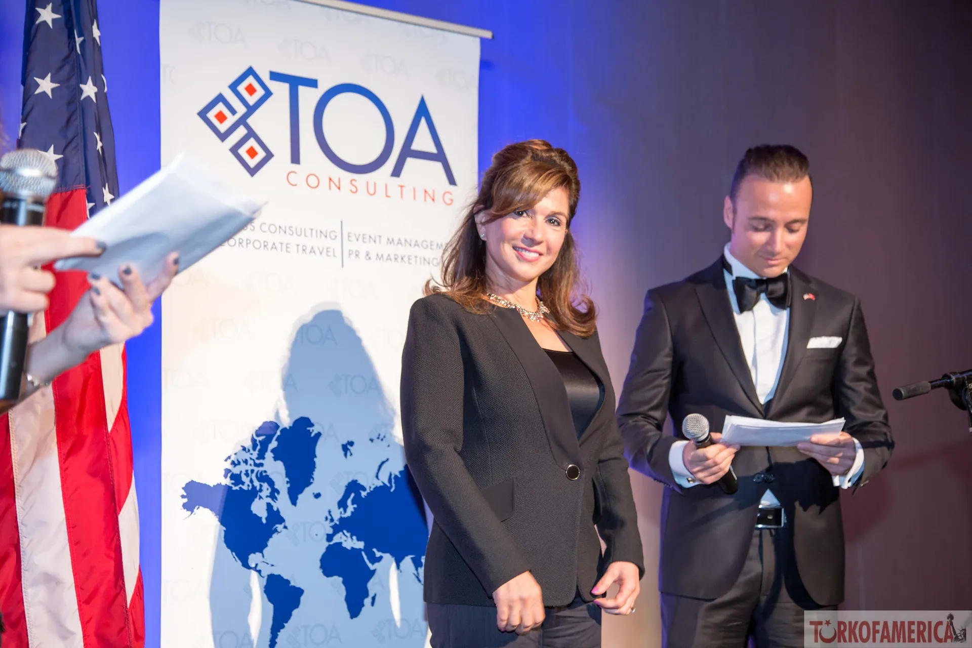 Hosts on stage at a TOA Awards ceremony